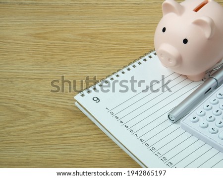 piggy bank on wood table for  Finance or saving money business content.
