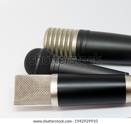 A closeup shot of different types of microphone isolated on white background