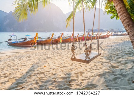 Sea beach atmosphere on Phi Phi Island, Krabi Province, very clear water, beautiful sea, white sandy beach, little tourists Between COVID-19 There are many taxi boats parked. Without tourists,
