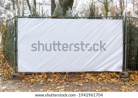 Construction fence with space for banner advertising Royalty-Free Stock Photo #1942961704