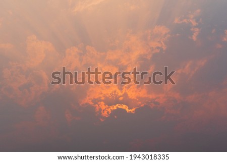 The Pastel Color sky with sun light shines through the clouds. 
