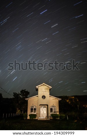Stellar tracks on a moonlit night above church of Bom Jardim - Nobres - MT - Brazil