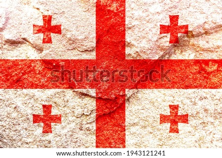 Vintage Georgia national flag icon pattern isolated on weathered solid rock wall background, abstract positive design faithful Georgian country politics society concept texture wallpaper