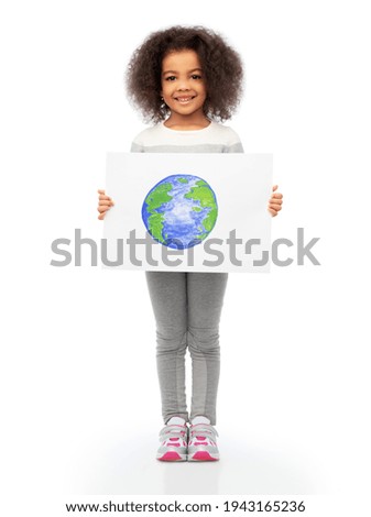 smiling girl holding drawing of earth planet