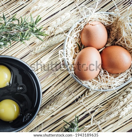 Photography of organic eggs also accompanied by open eggs with the yolk and the white.  Made with natural light, controlled on a tripod and reflectors.