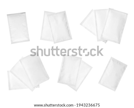 Set with sachets of medicine on white background, top view 