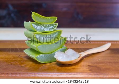 Green fresh Aloe vera sliced fresh aloe on wood table