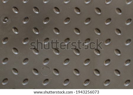 A background of bulging pimples. Plastic shoe tray. Background with gray raised details. Bulging oval elements
