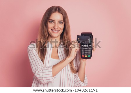 Photo of lady hold wireless credit card terminal
