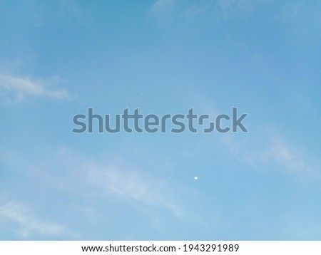 White clouds on blue sky background. Nature photography. Sky picture in sunlight. Tiny and soft clouds on blue sky background 