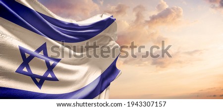 Israel flag in the blue sky. Horizontal panoramic banner. Royalty-Free Stock Photo #1943307157
