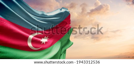 Azerbaijan flag in the blue sky. Horizontal panoramic banner. Royalty-Free Stock Photo #1943312536