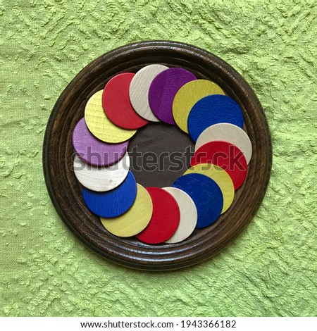 Framed Collage with Colored Wooden Circles