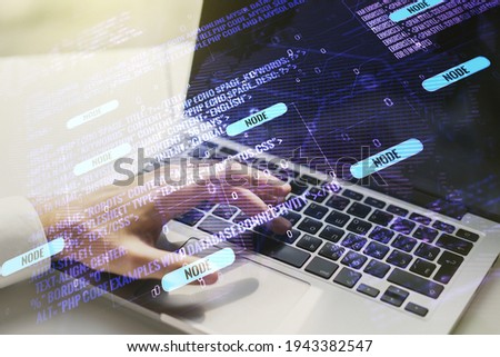 Double exposure of abstract creative programming illustration with world map and hand typing on laptop on background, big data and blockchain concept