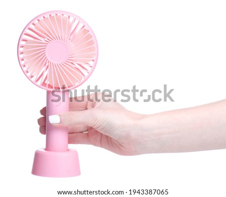 portable mini fan in hand on white background isolation