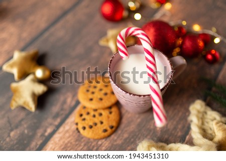christmas background, new year mood. A glass of milk with gingerbread. Christmas gingerbread. gingerbread with milk. new year lollipop.