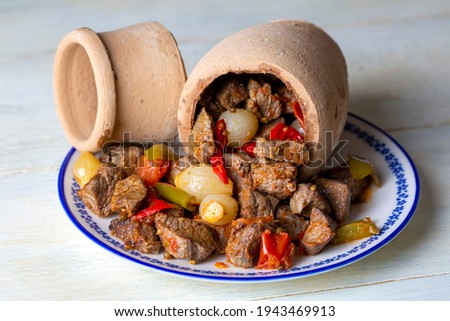 Authentic Turkish Testi Kebab cooked in earthenware waterjug, Turkish name; Testi kebabi Royalty-Free Stock Photo #1943469913