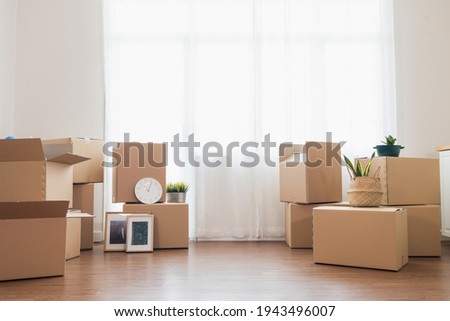 Cardboard boxes placed in containers for moving into the new home. copy space Royalty-Free Stock Photo #1943496007
