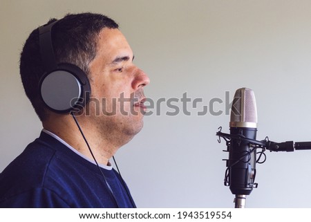 person with microphone read to record