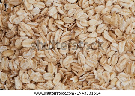 Rolled oats full frame background Royalty-Free Stock Photo #1943531614