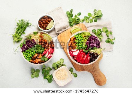 Tasty colorful vegan poke bowl on light gray background. Fresh healthy recipe. Top view, copy space