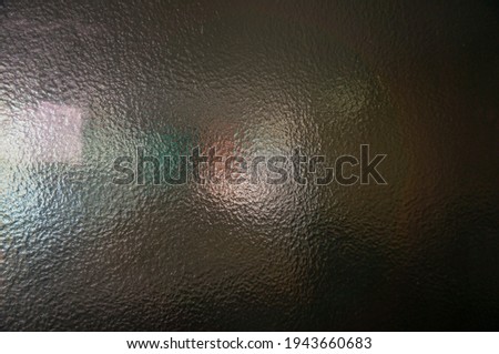 abstract background Dark multicolored glass window