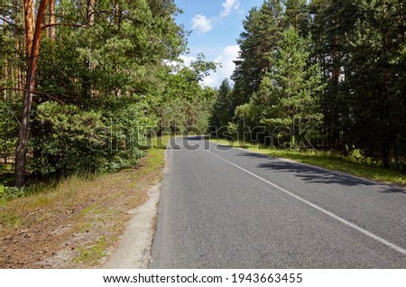 Asphalt twisty suburban road. A bend road at rural Europe