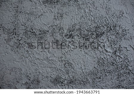 Wall with grey rough plaster. Loft-style background.