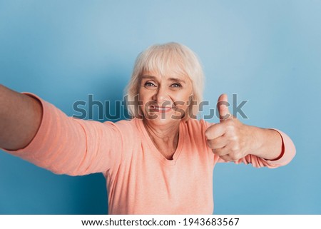Senior old woman make selfie raise thumb up