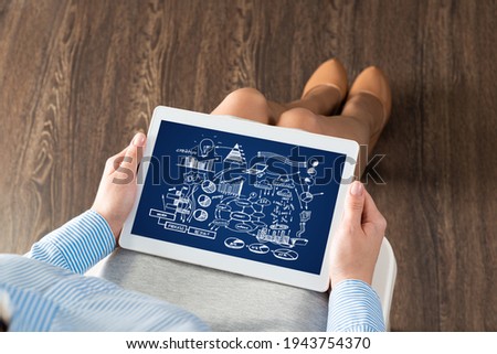 close-up, the business lady with the tablet. Concept of business planning