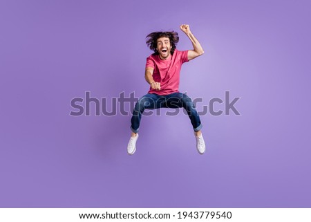 Full length photo of cool crazy young guy dressed pink outfit jumping riding horse isolated purple color background