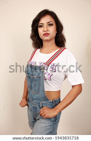 young lady poses with light white t-shirt 