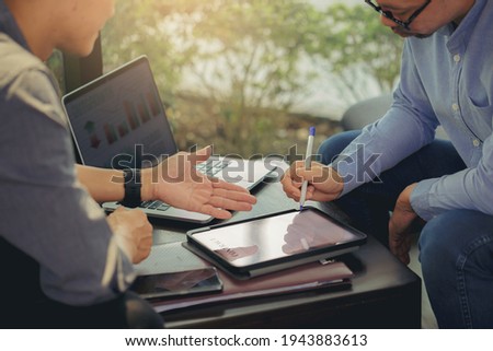 Businessman got a digital pencil to puts signature on digital contract at business meeting after negotiations with business partners. Selected focus