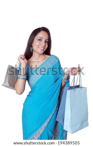 Asian traditional girl in sari carrying shopping bags
