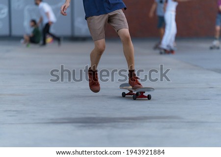 Close-up of people​ is playing surf skate or skateboard outdoors on summer day