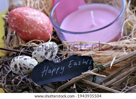 Happy Easter decoration with candle and note 