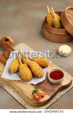 vegetable chicken drumstick or kaki naga on the wooden board  Royalty-Free Stock Photo #1943944714