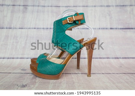 women's sandals on a wooden background.