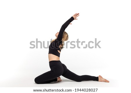 The girl practices yoga poses.
Doing sports on a white background.