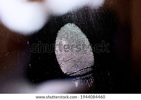 The fingerprint trace secured by the police at the scene. Royalty-Free Stock Photo #1944084460