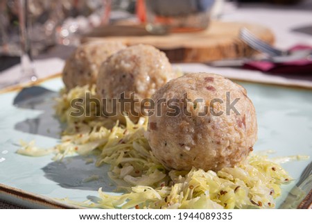 A picture of a plate of Canederli, a typical italian pasta made with bread, Cortina D'Ampezzo, Italy