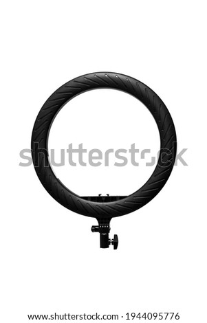 Closeup of circular neon LED lamp isolated white background. Popular modern light for make-up and beauty portraits.