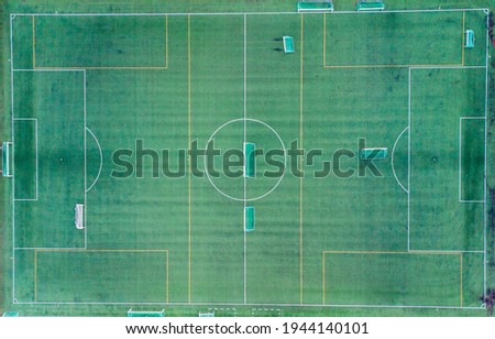 An aerial view of a football field with painted lines and goalposts Royalty-Free Stock Photo #1944140101