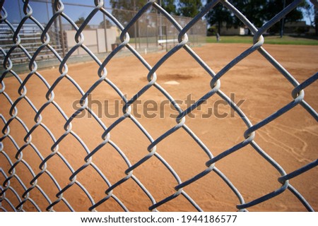 Baseball field behind chain-link fence