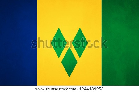 Creative grunge flag of Saint Vincent and the Grenadines country with shining background