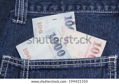 Thai baht notes in jeans pocket