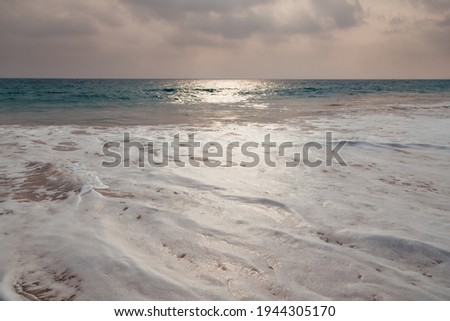 Foamy waves of the sandy beach of Indian ocean at Sri-Lanka.