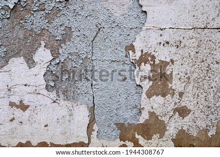 Detailed close up view on aged concrete walls with cracks and lots of structured details