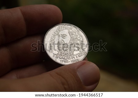 Ancient coin with the face of the Brazilian called Tiradentes Royalty-Free Stock Photo #1944366517