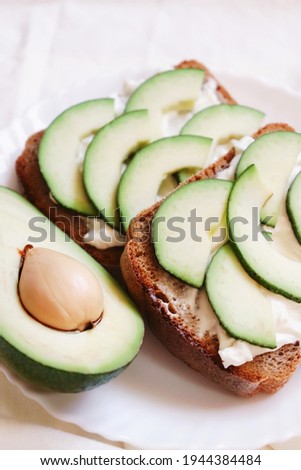 Avocado toast appetizer closeup food photography. Wellness diet, fitness nutrition, healthy eating concept